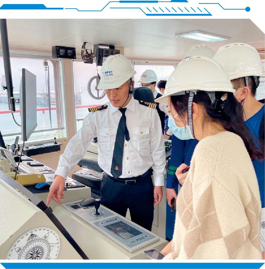 The captain of the work vessel showing OFCA staff members the monitoring system used for laying the submarine  fibre-based cables connecting Lamma Island, Cheung Chau and Peng Chau.