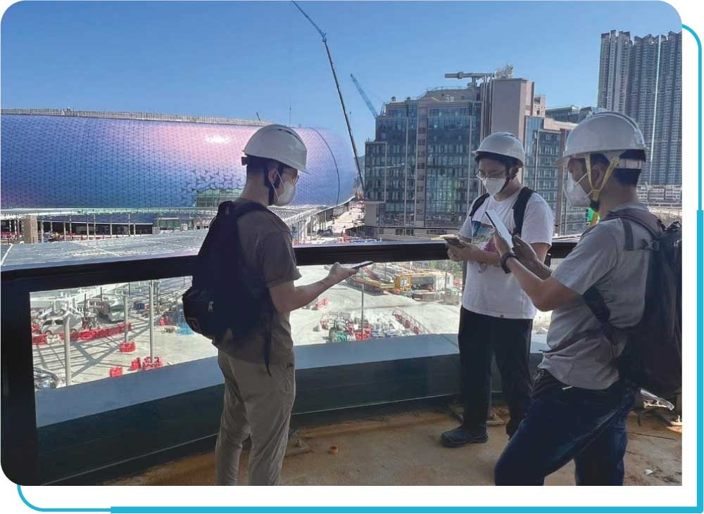 OFCA staff members carrying out a mobile coverage measurement at Kai Tak Sports Park.